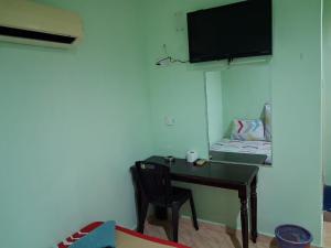 TV a/nebo společenská místnost v ubytování Ark Banting Hotel + 1 fotografie