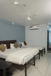 a bedroom with two beds in a room at Teja Hotel in Lūnāvāda +35 photos