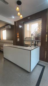 a reception desk in a room with a large window at R D Palace and Resort in Bhauli