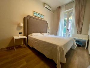 Postel nebo postele na pokoji v ubytování Hotel Rosa Dei Venti