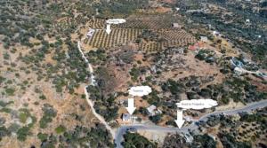 an aerial view of a house with trees and a road at Triopetra Green Dream in Triopetra