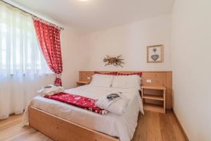 Postel nebo postele na pokoji v ubytování Dolomites Essence