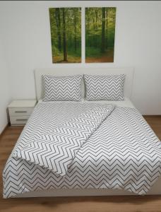 a bedroom with a white bed with a window at Walldürn Zentrum 1 in Walldürn