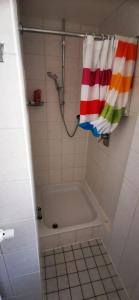 a bathroom with a bath tub and a towel at Walldürn Zentrum 1 in Walldürn