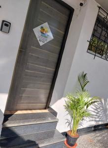 a stair case with a sign on the wall at Goa Beach Apartment in Colva +8 photos