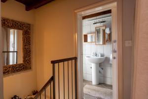 a bathroom with a sink and a mirror at Villa Monti Cozy Yard & BBQ Perfect for Families & Friends in Kato Lefkara +71 photos