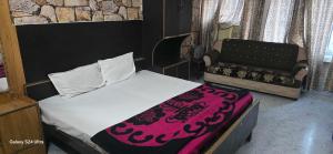 Ένα ή περισσότερα κρεβάτια σε δωμάτιο στο Hotel O Elysian