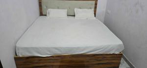 Ένα ή περισσότερα κρεβάτια σε δωμάτιο στο Hotel O Elysian