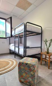 En eller flere senge i et værelse på Hotel Ribesalbes Albergue deportivo