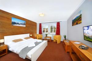 Postel nebo postele na pokoji v ubytování Hotel Erika