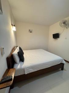 Postel nebo postele na pokoji v ubytování บ้านในฝัน เชียงคาน + 4 fotografie