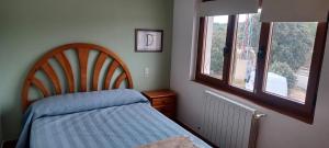 En eller flere senge i et værelse på Apartamentos Turísticos San Cristóbal by Bossh! Hotels