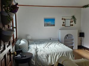 En eller flere senge i et værelse på Bomstay in Choryang