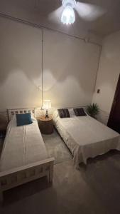 Кровать или кровати в номере A la Gurda Hostel - Barrio Sur