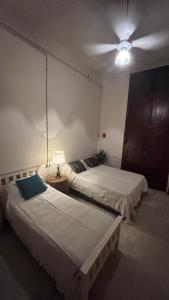 Кровать или кровати в номере A la Gurda Hostel - Barrio Sur