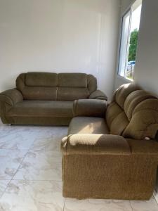 a living room with two couches and a couch at Apartamento in Espirito Santo Do Pinhal