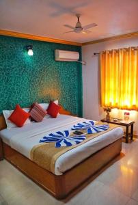 Postel nebo postele na pokoji v ubytování Krish Hotel Baga