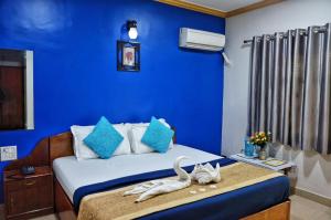 Postel nebo postele na pokoji v ubytování Krish Hotel Baga + 46 fotografií