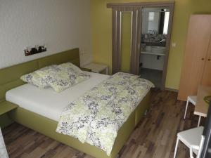 Posteľ alebo postele v izbe v ubytovaní Hotel Olga