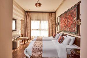 a hotel room with two beds and a piano at 7 Gates Boutique Hotel Pyramids in Cairo +42 photos