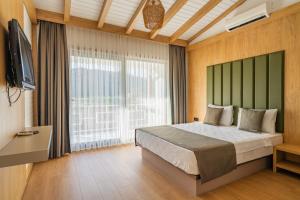 Postel nebo postele na pokoji v ubytování Perast Garden Hotel