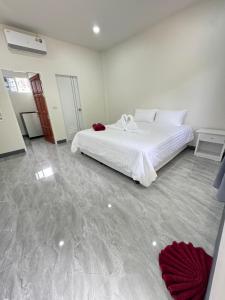 Postel nebo postele na pokoji v ubytování Karon Little House