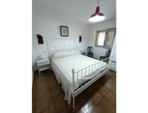 Postel nebo postele na pokoji v ubytování San Teodoro Living House