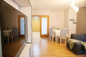 a dining room with a table and chairs at Meio Mundo in Várzea +16 photos