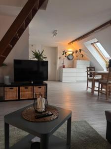 TV a/nebo společenská místnost v ubytování Ferienwohnung „Ruppbergblick“