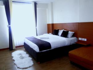 Кровать или кровати в номере Montage Luxury Hotel +15 фотографий