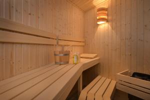 a sauna with a bench and a light in it at Watertoren Vlissingen in Vlissingen
