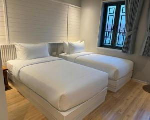 Postel nebo postele na pokoji v ubytování Tuan Hotel Bangkok