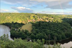 an aerial view of a village on a river at La bergerie - Point de vue sur la Creuse in Ceaulmont