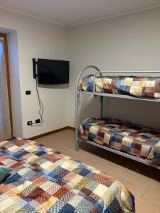 Una cama o camas en una habitación de Arlecchino Apartment di Manenti Andrea