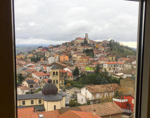 a view of a town from a window at Belvedere Vallata Affitti Brevi in Vallata +13 photos