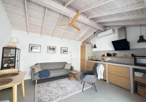 a living room with a couch and a table at Casitas Santa Rita in Guatiza