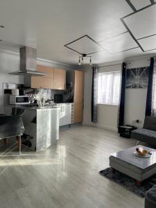 a large living room with a kitchen and a living room at Bowery Apartment - 2 Bedrooms 1st floor in Dagenham