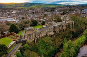 an aerial view of a castle in a city at Victoria Boutique Apartment in Skipton +19 photos