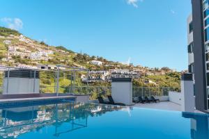 Swimmingpoolen hos eller tæt på GuestReady - A sweet escape in Caniço