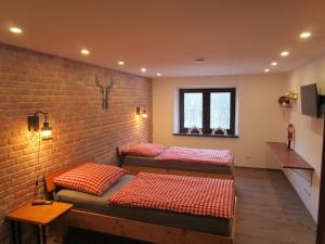 En eller flere senge i et værelse på Bergwiesnblick Apartments