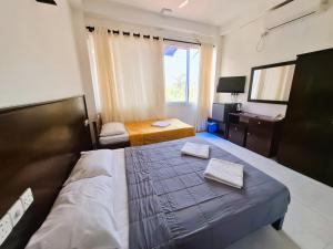 Ένα ή περισσότερα κρεβάτια σε δωμάτιο στο Blue Villa Wadduwa