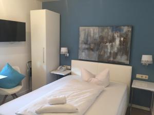 Postel nebo postele na pokoji v ubytování Arthotel Restaurant Pfeffermühle