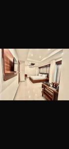 a large living room with a bed and a couch at Sea View Suites in Karachi