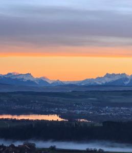 a view of the sunset with mountains in the background at Mont Blanc Chalet in Grandevent