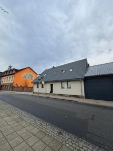 an empty street with buildings on the side of the road at Apartament Bors in Ribnitz-Damgarten