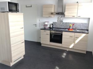 Kuchyň nebo kuchyňský kout v ubytování Murthum Gästeappartments