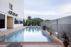 a swimming pool in the backyard of a house at CheckInn Garki, Abuja in Abuja