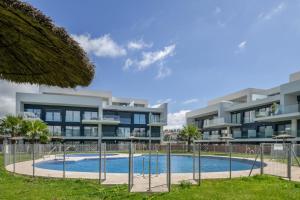 an image of an apartment building with a swimming pool at Atico de Lux Zahara in Zahara de los Atunes