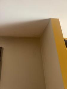 a corner of a room with a white ceiling at Woning in Damme nabij Brugge in Damme