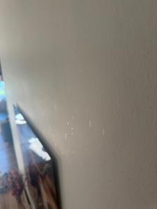 a close up of a white wall with a mirror at Woning in Damme nabij Brugge in Damme